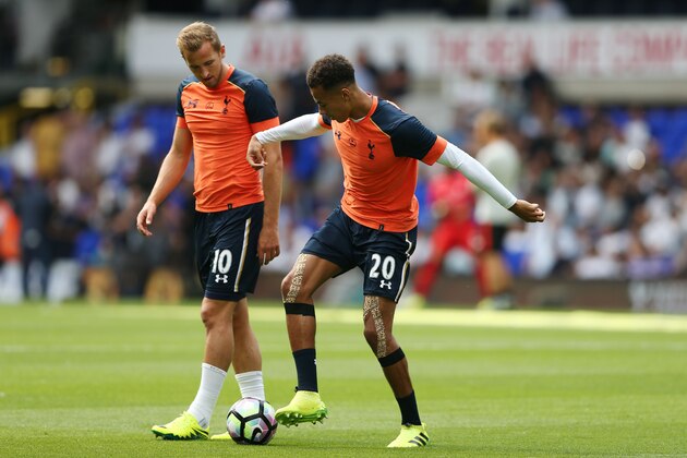Tottenham Hotspur's English striker Harry Kane (L) warms up with Tottenham Hotspur's English midfielder Dele Alli before the English Premier League football match between Tottenham Hotspur and Liverpool at White Hart Lane in London, on August 27, 2016. / AFP / JUSTIN TALLIS / RESTRICTED TO EDITORIAL USE. No use with unauthorized audio, video, data, fixture lists, club/league logos or 'live' services. Online in-match use limited to 75 images, no video emulation. No use in betting, games or single club/league/player publications.  /         (Photo credit should read JUSTIN TALLIS/AFP/Getty Images)