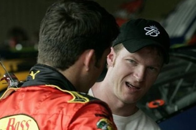 NASCAR driver Martin Truex Jr., left, listens to teammate Dale Earnhardt Jr., as they talk in the garage area during a practice session for the Neighborhood Excellence 400  Saturday, June 3, 2006 at the Dover Speedway in Dover, DE. (AP Photo/Russell Hamilton Jr)