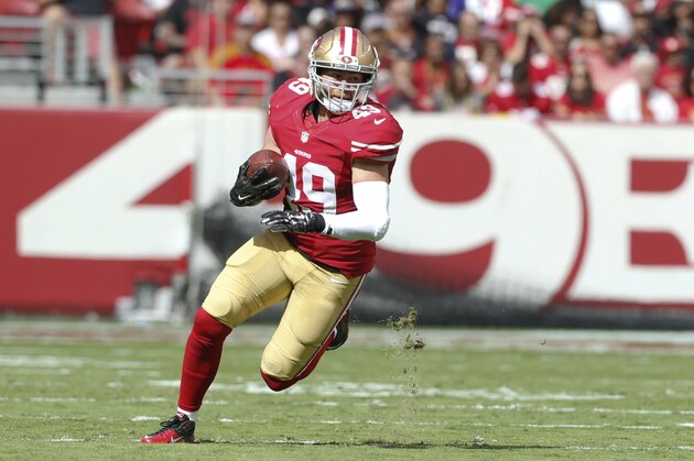 SANTA CLARA, CA - OCTOBER 18: Bruce Miller #49 of the San Francisco 49ers takes takes the ball 52-yards on a touchdown reception after making a reception during the game against the Baltimore Ravens at Levi Stadium on October 18, 2015 in Santa Clara, California. The 49ers defeated the Ravens 25-20. (Photo by Michael Zagaris/San Francisco 49ers/Getty Images)