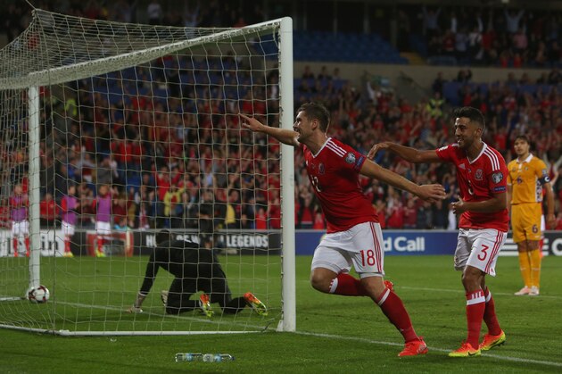 Wales's striker Sam Vokes celebrates after scoring his team's first goal with Wales's defender Neil Taylor during the World Cup 2018 football qualification match between Wales and Moldova at Cardiff City Stadium in Cardif, south Wales, on September 5, 2016. / AFP / GEOFF CADDICK        (Photo credit should read GEOFF CADDICK/AFP/Getty Images)