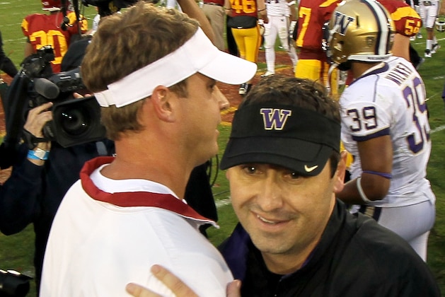 LOS ANGELES, CA - NOVEMBER 12:  Head coach Steve Sarkisian of the Washington Huskies greets head coach Layne Kiffin of the USC Trojans after their game at the Los Angeles Memorial Coliseum on November 12, 2011 in Los Angeles, California.  USC won 40-17.  (Photo by Stephen Dunn/Getty Images)