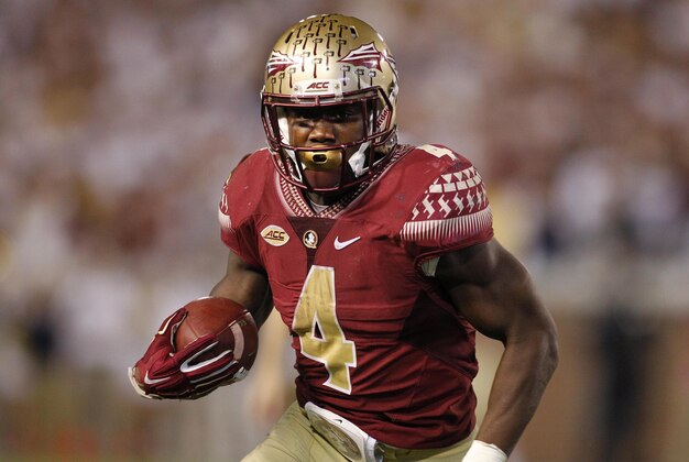 Oct 24, 2015; Atlanta, GA, USA; Florida State Seminoles running back Dalvin Cook (4) runs the ball against the Georgia Tech Yellow Jackets in the fourth quarter at Bobby Dodd Stadium. Georgia Tech defeated Florida State 22-16. Mandatory Credit: Brett Davis-USA TODAY Sports