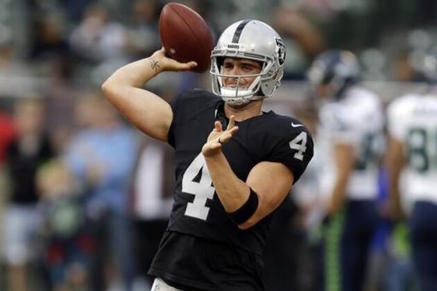 FILE - In this Sept. 1, 2016, file photo, Oakland Raiders quarterback Derek Carr warms up before a preseason NFL football game against the Seattle Seahawks Thursday, Sept. 1, 2016, in Oakland, Calif. Soon after Derek Carr and Khalil Mack were drafted by the Oakland Raiders in 2014, they got together and vowed to change the culture of a franchise that had only known losing for more than a decade.  With the franchise quarterback and pass rusher entering their third season as pros, that has been accomplished. Now the Raiders have their sights set on larger goals of getting back to the playoffs for the first time since 2002.  (AP Photo/Ben Margot, File)