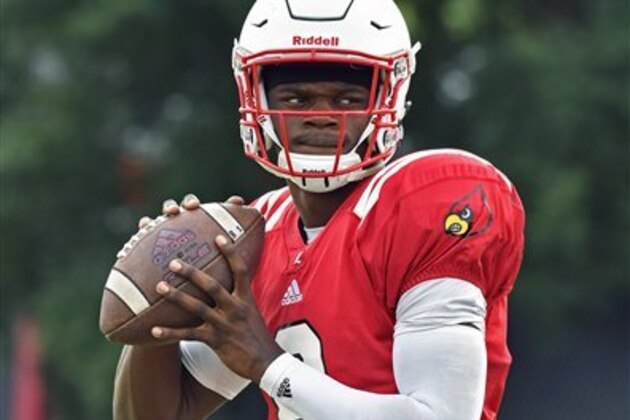 University of Louisville sophomore quarterback Lamar Jackson warms up before the start of the team's morning practice at the Louisville practice facility, Tuesday, Aug. 16, 2016 in Louisville Ky. (AP Photo/Timothy D. Easley)