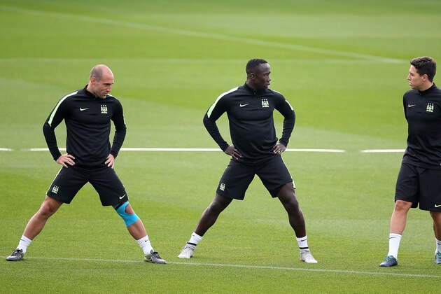 MANCHESTER, ENGLAND - SEPTEMBER 29:  (L-R) Pablo Zabaleta, Bacary Sagna and Samir Nasri chat during a Manchester City training session ahead of their Champions League fixture against Borussia Moenchengladbach at City Football Academy on September 29, 2015 in Manchester, England.  (Photo by Jan Kruger/Getty Images)