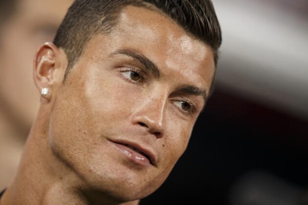 Real Madrid's Cristiano Ronaldo reacts before a Santiago Bernabeu Trophy soccer match between Real Madrid and Stade de Reims at the Santiago Bernabeu stadium in Madrid, Spain, Tuesday, Aug. 16, 2016. (AP Photo/Daniel Ochoa de Olza)
