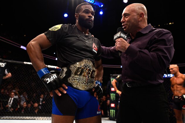 ATLANTA, GA - JULY 30:  (L-R) Tyron Woodley talks to UFC commentator after his knockout victory over Robbie Lawler in their welterweight championship bout during the UFC 201 event on July 30, 2016 at Philips Arena in Atlanta, Georgia. (Photo by Jeff Bottari/Zuffa LLC/Zuffa LLC via Getty Images)
