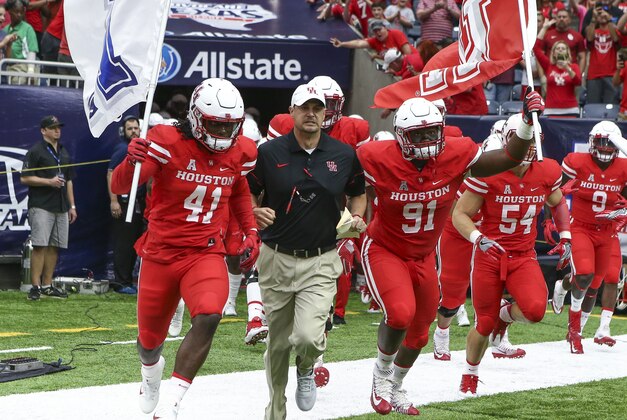 Sep 3, 2016; Houston, TX, USA; Houston Cougars head coach Tom Herman runs onto the field with the team before a game against the Oklahoma Sooners at NRG Stadium. Mandatory Credit: Troy Taormina-USA TODAY Sports