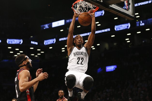 NEW YORK, NY - APRIL 13:   Markel Brown #22 of the Brooklyn Nets dunks in front of Cory Joseph #6 of the Toronto Raptors during their game at the Barclays Center on April 13, 2016 in New York City.  NOTE TO USER: User expressly acknowledges and agrees that, by downloading and/or using this photograph, user is consenting to the terms and conditions of the Getty Images License Agreement. (Photo by Jeff Zelevansky/Getty Images)