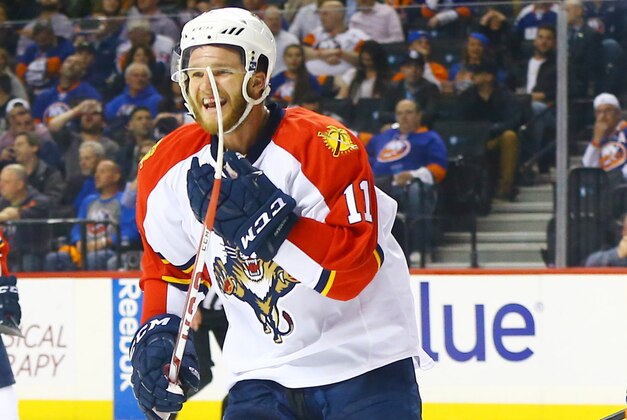 Apr 20, 2016; Brooklyn, NY, USA; Florida Panthers left wing Jonathan Huberdeau (11) reacts after his teammate defenseman Alex Petrovic (not pictured) scored the game winning goal against the  New York Islanders during the third period of game four of the first round of the 2016 Stanley Cup Playoffs against the Florida Panthers at Barclays Center. The Panthers won 2-1. Mandatory Credit: Andy Marlin-USA TODAY Sports