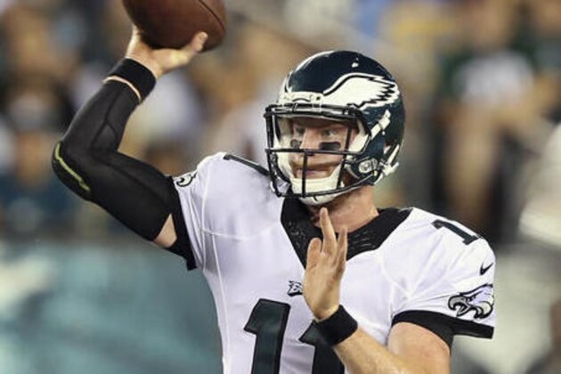 FILE - In this Aug. 11, 2016, file photo, Philadelphia Eagles rookie quarterback Carson Wentz (11) throws a pass during the second half of the team's preseason NFL football game against the Tampa Bay Buccaneers, in Philadelphia. Wentz will start for the Eagles against the Cleveland Browns on Sunday. Coach Doug Pederson made the announcement Monday, Sept. 5, 2016, two days after the Eagles traded Sam Bradford to the Vikings for a 2017 first-round pick and a 2018 conditional fourth-round pick. (AP Photo/Mel Evans, File)