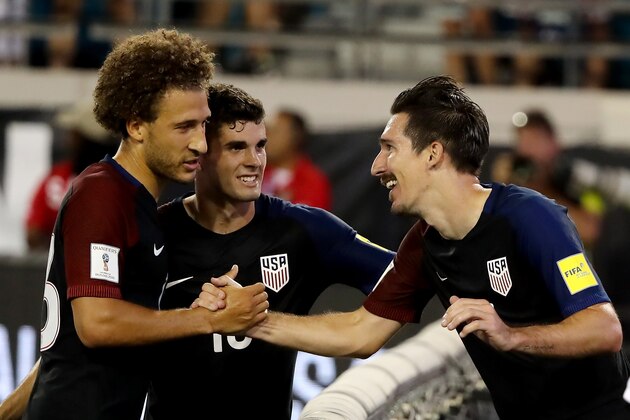 JACKSONVILLE, FL - SEPTEMBER 06:  Sacha Kljestan #16 of the United States (R) is congratulated by Christian Pulisic #10 and Fabian Johnson #23 following a goal during the FIFA 2018 World Cup Qualifier against Trinidad &Tobago at EverBank Field on September 6, 2016 in Jacksonville, Florida.  (Photo by Sam Greenwood/Getty Images)