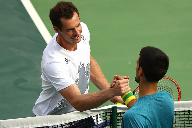 RIO DE JANEIRO, BRAZIL - AUGUST 02:  Andy Murray of Great Britain and Novak Djokovic of Serbia embrace at the net during a practice session ahead of the Rio 2016 Olympic Games at the Olympic Tennis Centre on August 2, 2016 in Rio de Janeiro, Brazil.  (Photo by Clive Brunskill/Getty Images)