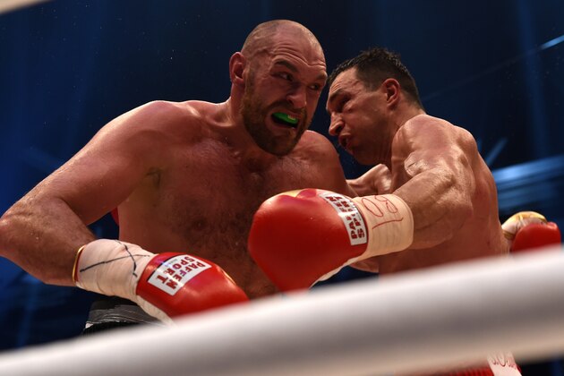 World heavyweight boxing champion Wladimir Klitschko (R) of Ukraine defends against Britain's Tyson Fury during their  WBA, IBF, WBO and IBO title bout in Duesseldorf, western Germany, on November 28, 2015.   Fury dethroned  Klitschko in a 12round decision to become world heavyweight champion. AFP PHOTO / PATRIK STOLLARZ / AFP / PATRIK STOLLARZ        (Photo credit should read PATRIK STOLLARZ/AFP/Getty Images)