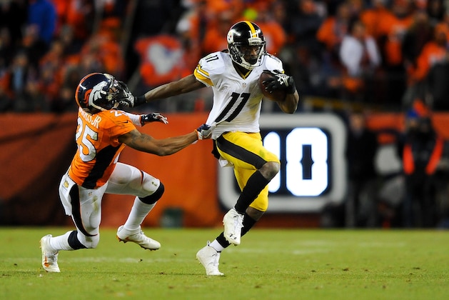 DENVER, CO - JANUARY 17: Markus Wheaton #11 of the Pittsburgh Steelers gives a stiff-arm to Chris Harris #25 of the Denver Broncos  during the AFC Divisional Playoff Game at Sports Authority Field at Mile High on January 17, 2016 in Denver, Colorado. (Photo by Dustin Bradford/Getty Images)