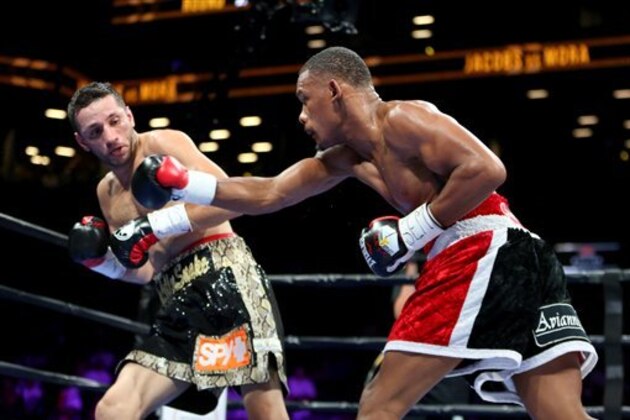 Daniel Jacobs, right, in action against Sergio Mora during their WBA Middleweight title fight at the Barclays Center in Brooklyn, on Saturday, August 1, 2015. (AP Photo/Gregory Payan)