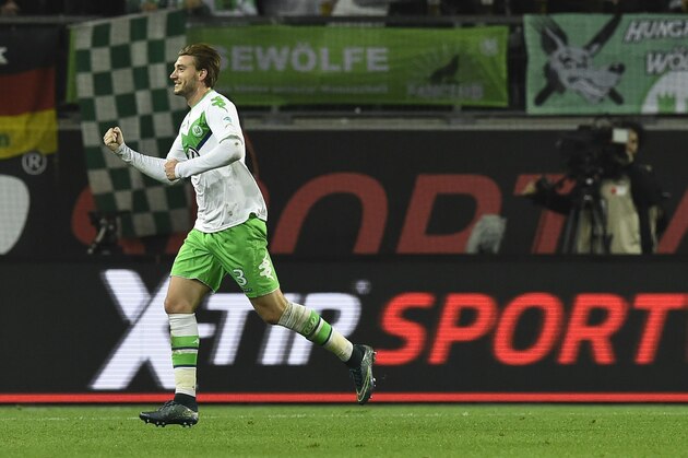 Wolfsburg's Danish forward Nicklas Bendtner celebrates after scoring during the German first division Bundesliga football match Wolfsburg vs Leverkusen in Wolfsburg on October 31, 2015. 
AFP PHOTO / TOBIAS SCHWARZ

RESTRICTIONS: DURING MATCH TIME: DFL RULES TO LIMIT THE ONLINE USAGE TO 15 PICTURES PER MATCH AND FORBIDS IMAGE SEQUENCES TO SIMULATE VIDEO.
== RESTRICTED TO EDITORIAL USE ==
FOR FURTHER QUERIES PLEASE CONTACT DFL DIRECTLY AT + 49 69 650050.        (Photo credit should read TOBIAS SCHWARZ/AFP/Getty Images)