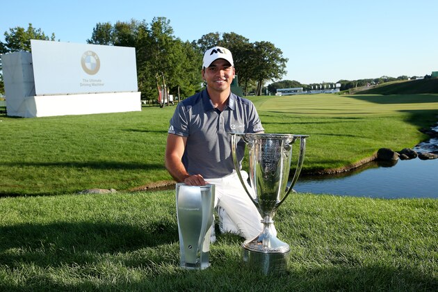 LAKE FOREST, IL - SEPTEMBER 20:  Jason Day of Australia celebrates with the winner's trophy after the Final Round of the BMW Championship at Conway Farms Golf Club on September 20, 2015 in Lake Forest, Illinois.  (Photo by Patrick Smith/Getty Images)