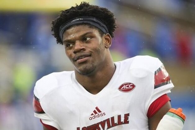 Louisville quarterback Lamar Jackson walks to the sidelines after an injury during the second half of an NCAA college football game Saturday, Nov. 28, 2015, in Lexington, Ky. Louisville won the game 38-24. (AP Photo/David Stephenson)