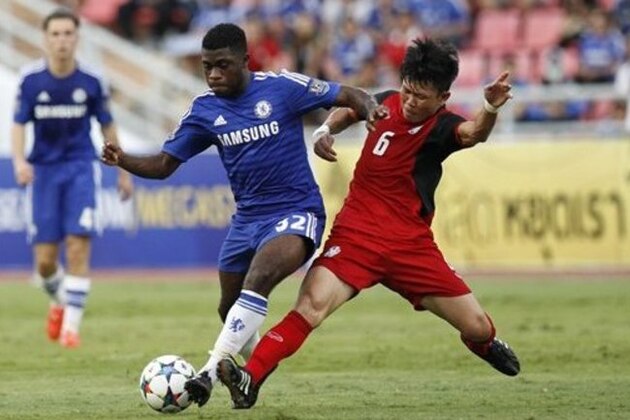 Chelsea's Jeremie Boga, left,  in action with Thailand All Star Yuthajak Konjan during their friendly soccer match at Rajamangala national stadium in Bangkok, Thailand, Saturday, May 30, 2015.  Chelsea beat Thailand All-Stars 1-0. (AP Photo/Sakchai Lalit)