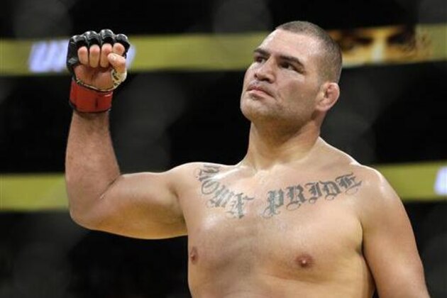 Cain Velasquez celebrates after defeating Travis Browne during their heavyweight mixed martial arts bout at UFC 200, Saturday, July 9, 2016, in Las Vegas. (AP Photo/John Locher)