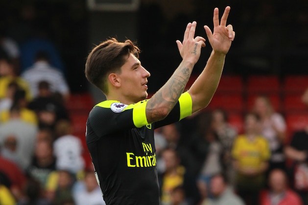 Arsenal's Spanish defender Hector Bellerin gestures to supporters on the pitch after the English Premier League football match between Watford and Arsenal at Vicarage Road Stadium in Watford, north of London on August 27, 2016.
Arsenal won the game 3-1. / AFP / Sean Dempsey / RESTRICTED TO EDITORIAL USE. No use with unauthorized audio, video, data, fixture lists, club/league logos or 'live' services. Online in-match use limited to 75 images, no video emulation. No use in betting, games or single club/league/player publications.  /         (Photo credit should read SEAN DEMPSEY/AFP/Getty Images)