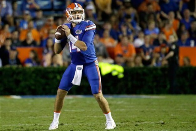 Florida quarterback Luke Del Rio (14) looks for a receiver against Massachusetts during the second half of an NCAA college football game, Saturday, Sept. 3, 2016, in Gainesville, Fla. (AP Photo/John Raoux)