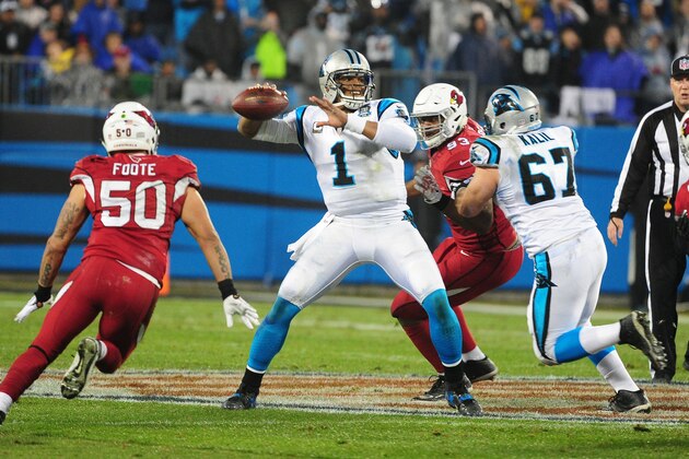CHARLOTTE, NC - JANUARY 3: Cam Newton #1 of the Carolina Panthers passes against the Arizona Cardinals during the NFC Wild Card Playoff game on January 3, 2015 at Bank of America Stadium in Charlotte, North Carolina.  (Photo by Scott Cunningham/Getty Images)