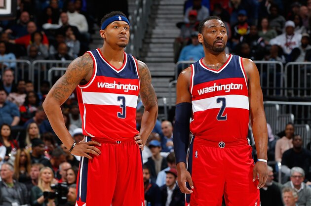 ATLANTA, GA - MARCH 21:  John Wall #2 and Bradley Beal #3 of the Washington Wizards look on during free throws against the Atlanta Hawks at Philips Arena on March 21, 2016 in Atlanta, Georgia.  NOTE TO USER User expressly acknowledges and agrees that, by downloading and or using this photograph, user is consenting to the terms and conditions of the Getty Images License Agreement.  (Photo by Kevin C. Cox/Getty Images)