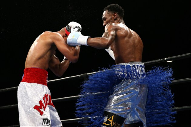 WASHINGTON, DC - APRIL 01: Robert Easter (R) punches Algenis Mendez in their lightweights bout at the DC Armory on April 1, 2016 in Washington, DC. (Photo by Patrick Smith/Getty Images)