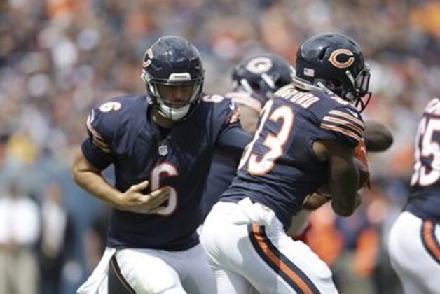 Chicago Bears quarterback Jay Cutler (6) hands off the ball to running back Jeremy Langford (33) during the first half of an NFL preseason football game, Saturday, Aug. 27, 2016, in Chicago. (AP Photo/Tom Lynn)