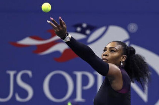 Serena Williams, of the United States, tosses the ball to serve to Simona Halep, of Romania, during a quarterfinal match at the U.S. Open tennis tournament, Wednesday, Sept. 7, 2016, in New York. (AP Photo/Charles Krupa)