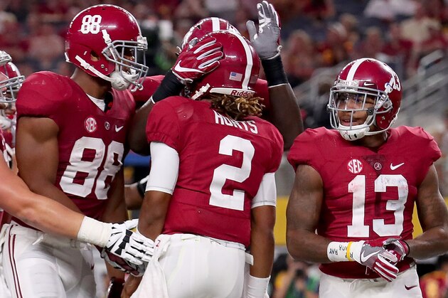 ARLINGTON, TX - SEPTEMBER 03:  Jalen Hurts #2 of the Alabama Crimson Tide celebrates with Ross Pierschbacher #71 of the Alabama Crimson Tide, O.J. Howard #88 of the Alabama Crimson Tide and ArDarius Stewart #13 of the Alabama Crimson Tide after scoring a touchdown against the USC Trojans during the AdvoCare Classic at AT&T Stadium on September 3, 2016 in Arlington, Texas.  (Photo by Tom Pennington/Getty Images)