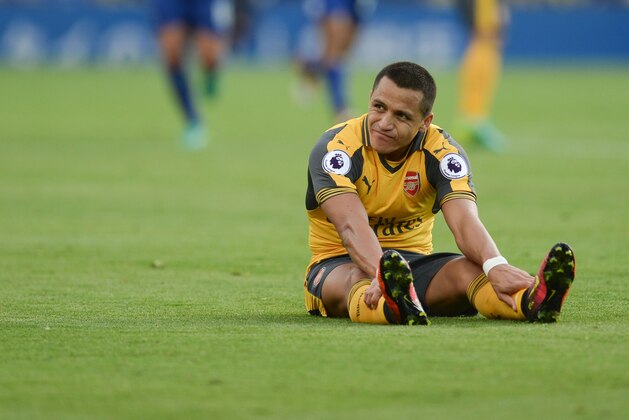 Arsenal's Chilean striker Alexis Sanchez reacts during the English Premier League football match between Leicester City and Arsenal at King Power Stadium in Leicester, central England on August 20, 2016. / AFP / OLI SCARFF / RESTRICTED TO EDITORIAL USE. No use with unauthorized audio, video, data, fixture lists, club/league logos or 'live' services. Online in-match use limited to 75 images, no video emulation. No use in betting, games or single club/league/player publications.  /         (Photo credit should read OLI SCARFF/AFP/Getty Images)