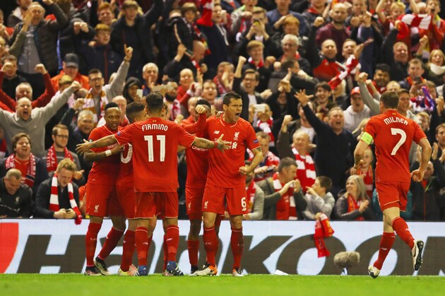 LIVERPOOL, UNITED KINGDOM - MAY 05:  Dejan Lovren (6) celebrates with team mates and fans as Adam Lallana of Liverpool (obscured) scores their third goal during the UEFA Europa League semi final second leg match between Liverpool and Villarreal CF at Anfield on May 5, 2016 in Liverpool, England.  (Photo by Richard Heathcote/Getty Images)