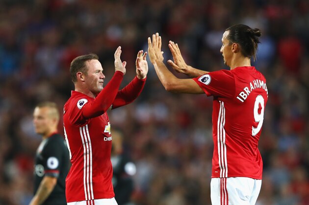 MANCHESTER, ENGLAND - AUGUST 19:  Zlatan Ibrahimovic of Manchester United celebrates scoring the opening goal with Wayne Rooney of Manchester United during the Premier League match between Manchester United and Southampton at Old Trafford on August 19, 2016 in Manchester, England.  (Photo by Michael Steele/Getty Images)