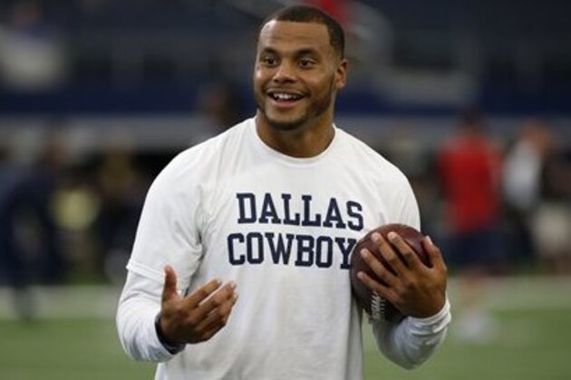 Dallas Cowboys quarterback Dak Prescott smiles during warm ups before the Dallas Cowboys take on the Houston Texans in a preseason NFL football game, Thursday, Sept. 1, 2016, in Arlington, Texas. (AP Photo/Ron Jenkins)