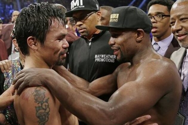 FILE - This May 2, 2015 file photo shows Manny Pacquiao, from the Philippines, left, and Floyd Mayweather Jr., embrace in the ring at the finish of their welterweight title fight in Las Vegas. Boxing fans across the country or at least their lawyers are calling the hyped-up fight between Pacquiao and Mayweather a fraud. Some 31 class action lawsuits had been filed through Friday alleging primarily the same thing: that Pacquiao's pre-existing shoulder injury should have been disclosed to fans ahead of time. (AP Photo/Isaac Brekken,File)