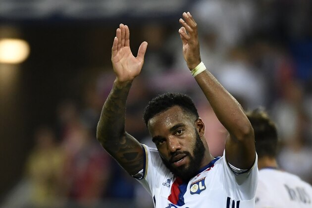 Lyon's French forward Alexandre Lacazette celebrates after scoring his second goal during the French Ligue 1 football match Olympique Lyonnais (OL) against Caen (SMC) on August 19, 2016, at the Parc Olympique Lyonnais stadium in Decines-Charpieu near Lyon, southeastern France. / AFP / PHILIPPE DESMAZES        (Photo credit should read PHILIPPE DESMAZES/AFP/Getty Images)