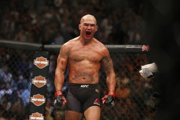 Robbie Lawler celebrates after defeating Rory MacDonald during their welterweight title fight mixed martial arts bout at UFC 189 Saturday, July 11, 2015, in Las Vegas. (AP Photo/John Locher)