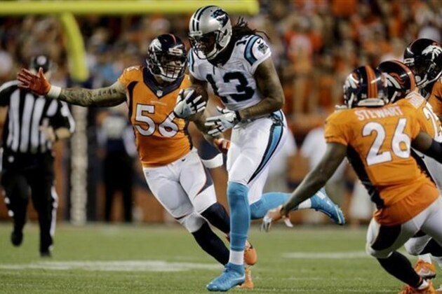 Carolina Panthers wide receiver Kelvin Benjamin (13) runs as Denver Broncos linebacker Shane Ray (56) pursues during the first half of an NFL football game, Thursday, Sept. 8, 2016, in Denver. (AP Photo/Joe Mahoney)