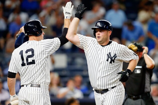 NEW YORK, NY - SEPTEMBER 08:  Brian McCann #34 of the New York Yankees celebrates his fourth inning home run against the Tampa Bay Rays with teammate Chase Headley #12 at Yankee Stadium on September 8, 2016 in the Bronx borough of New York City.  (Photo by Jim McIsaac/Getty Images)