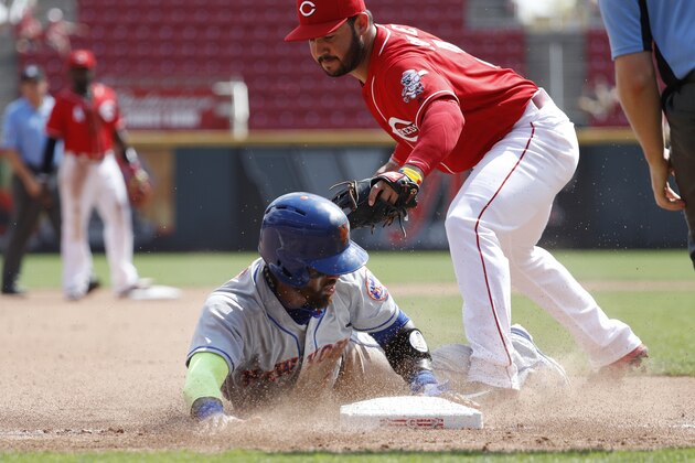 CINCINNATI, OH - SEPTEMBER 07: Jose Reyes #7 of the New York Mets gets tagged out at third base by Eugenio Suarez #7 of the Cincinnati Reds in the seventh inning at Great American Ball Park on September 7, 2016 in Cincinnati, Ohio. The Mets defeated the Reds 6-3. (Photo by Joe Robbins/Getty Images)