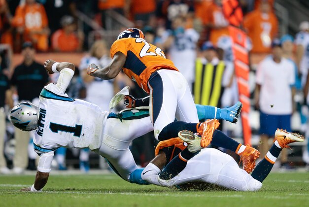 Sep 8, 2016; Denver, CO, USA; Carolina Panthers quarterback Cam Newton (1) is hit by Denver Broncos free safety Darian Stewart (26) in the fourth quarter at Sports Authority Field at Mile High. Mandatory Credit: Isaiah J. Downing-USA TODAY Sports