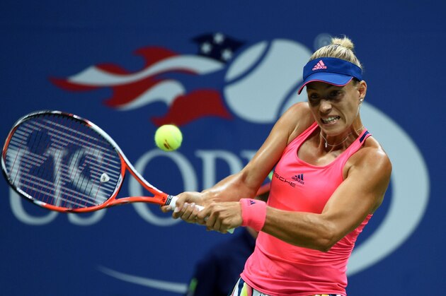 Angelique Kerber of Germany hits a return against Caroline Wozniacki of Denmark during their 2016 US Open Womens Singles semifinal match at the USTA Billie Jean King National Tennis Center in New York on September 8, 2016. / AFP / Timothy A. CLARY        (Photo credit should read TIMOTHY A. CLARY/AFP/Getty Images)