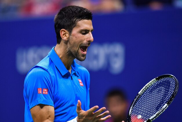 Novak Djokovic of Serbia reacts after losing a point against Jo-Wilfried Tsonga of France during their 2016 US Open Men's Singles match at the USTA Billie Jean King National Tennis Center in New York on September 6, 2016.
Defending champion Novak Djokovic reached his 10th successive US Open semi-final when Jo-Wilfried Tsonga retired from their quarter-final with a left knee injury while trailing 6-3, 6-2. / AFP / EDUARDO MUNOZ ALVAREZ        (Photo credit should read EDUARDO MUNOZ ALVAREZ/AFP/Getty Images)