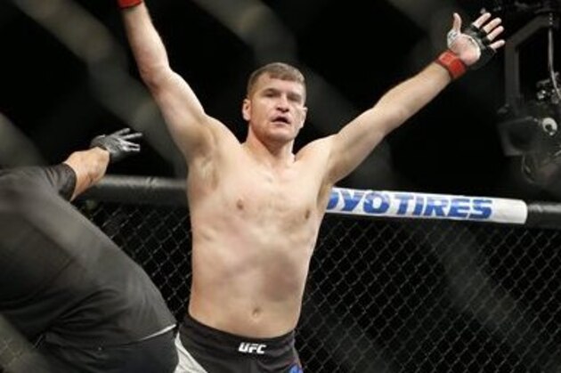 Stipe Miocic, right, celebrates after defeating Andrei Arlovski in a heavyweight mixed martial arts bout at UFC 195, Saturday, Jan. 2, 2016, in Las Vegas. (AP Photo/John Locher)