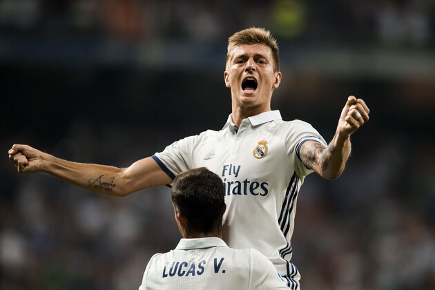 MADRID - AUGUST 27: Toni Kroos of Real Madrid celebrates with teammates during their La Liga match at the Santiago Bernabeu Stadium between Real Madrid and RC Celta de Vigo on 27 August 2016 in Madrid, Spain. (Photo by Power Sport Images/Getty Images)