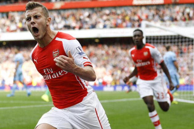 FILE - In this Saturday, Sept. 13, 2014 file photo, Arsenal's Jack Wilshere celebrates scoring a goal during the English Premier League soccer match between Arsenal and Manchester City at Emirates Stadium in London. Jack Wilshere has left Arsenal for a season-long loan at Bournemouth in a bid to revive an injury-stalled career, it was announced on Wednesday, Aug. 31, 2016. The 24-year-old midfielder had also been considering an offer from Crystal Palace after agreeing with Arsenal that he would benefit from playing regular first-team football. (AP Photo/Kirsty Wigglesworth, file)