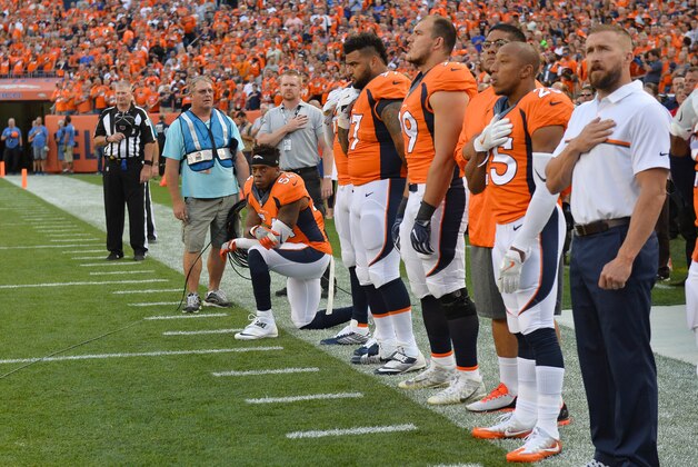 Sep 8, 2016; Denver, CO, USA; Denver Broncos inside linebacker Brandon Marshall (54) kneels during the national anthem before the game against the Carolina Panthers at Sports Authority Field at Mile High. Mandatory Credit: Ron Chenoy-USA TODAY Sports